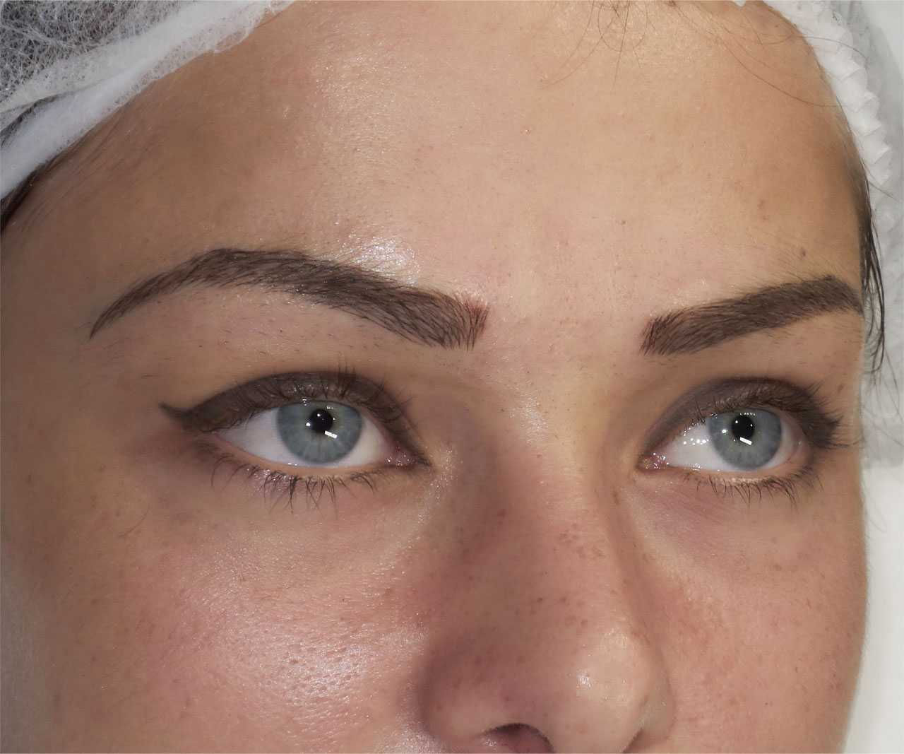 Girl eyebrows right after initial microblading